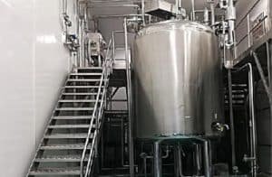 a large metal tank sitting inside of a building