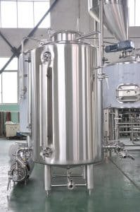 a large stainless steel tank sitting inside of a building