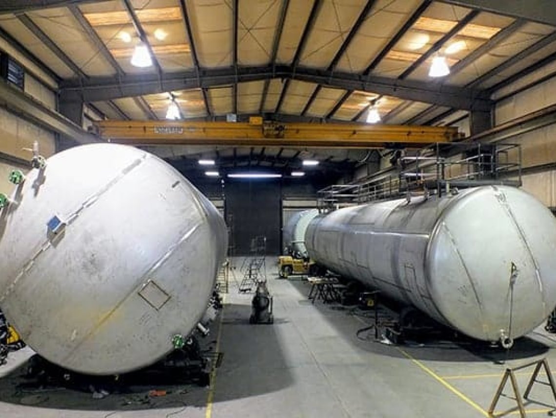 a couple of large tanks sitting inside of a building large tanks sitting inside of a building