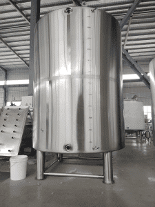 a large silver tank in a factory.