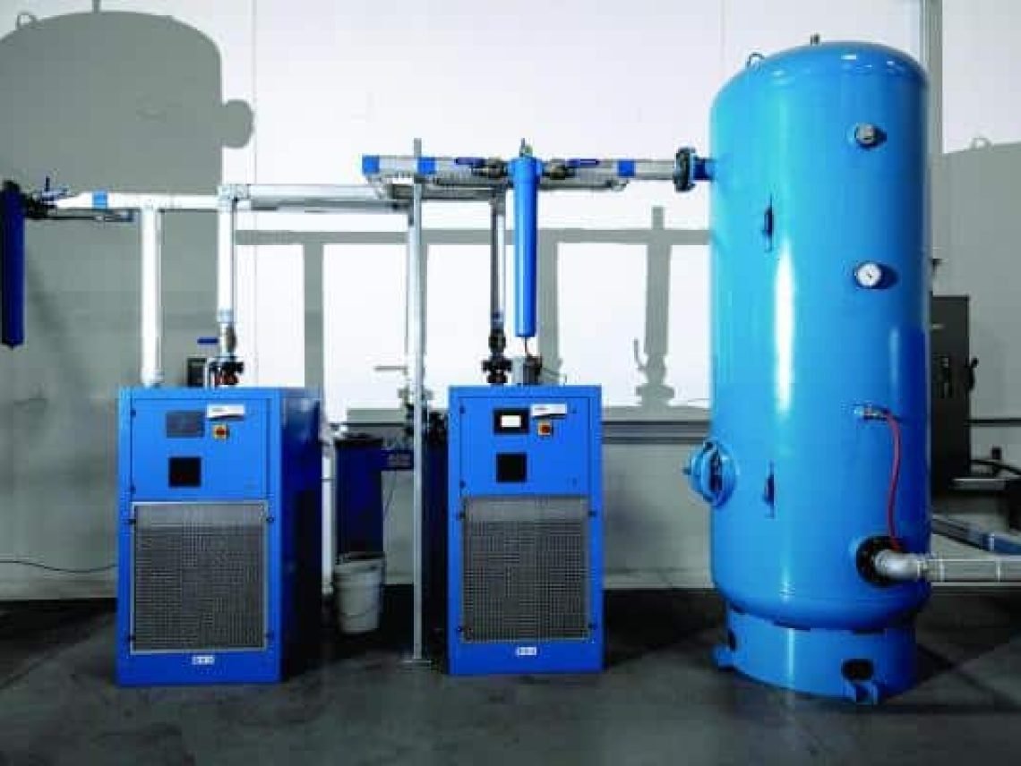 a large blue water heater sitting next to two smaller blue water heaters Blue water heater