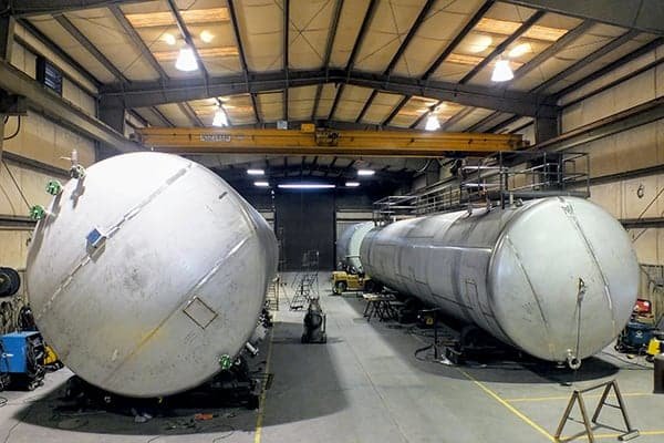 a couple of large tanks sitting inside of a building