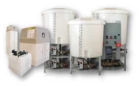 A group of three large tanks sitting next to each other