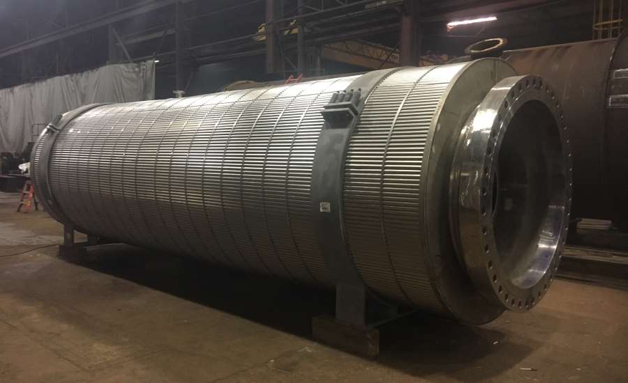 a large metal tube sitting inside of a warehouse