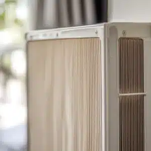 Close-up of a filter with pleated design, showcasing the texture and structure of an air conditioning system component.