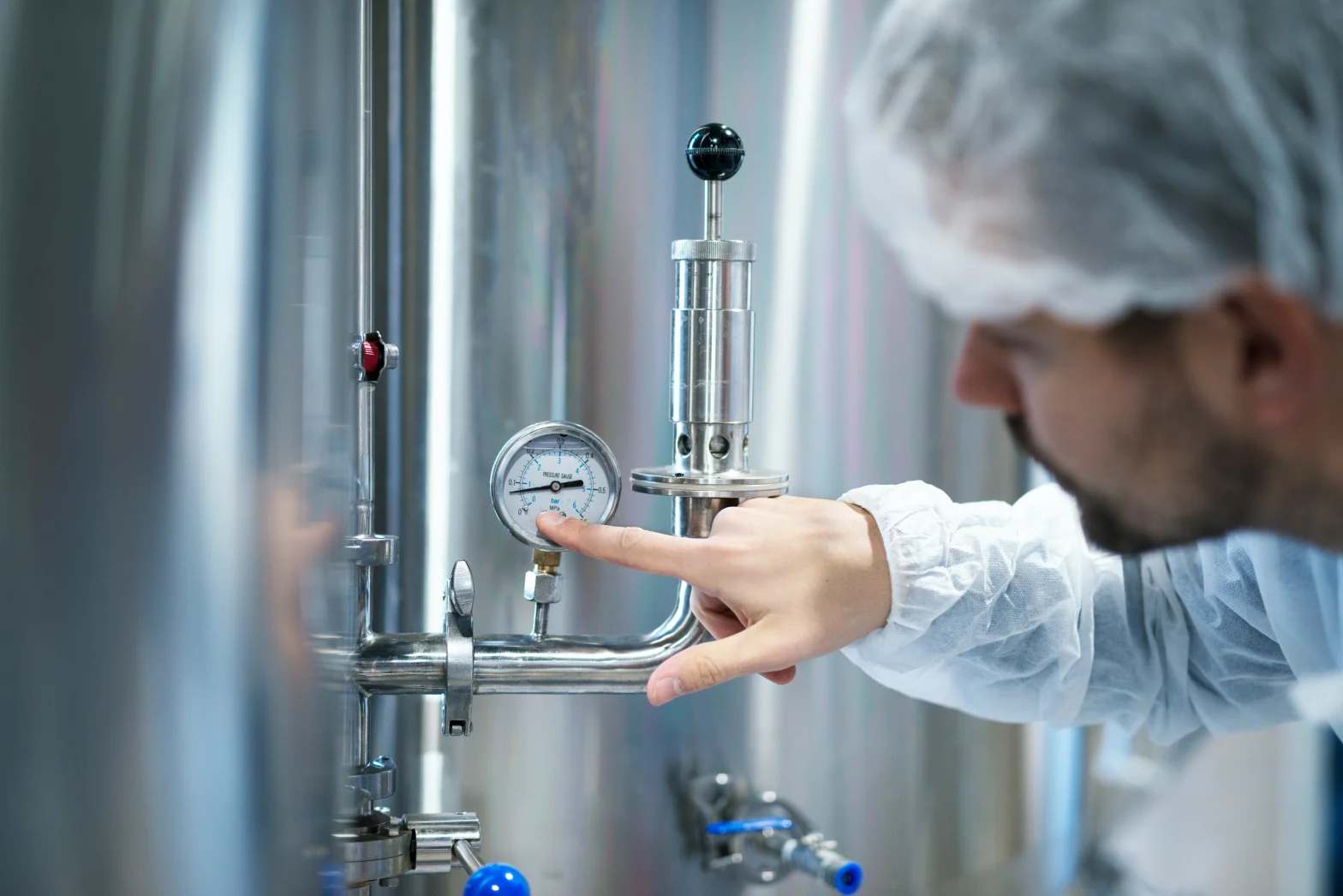 Technician inspecting welds during OEM pressure vessel manufacturing