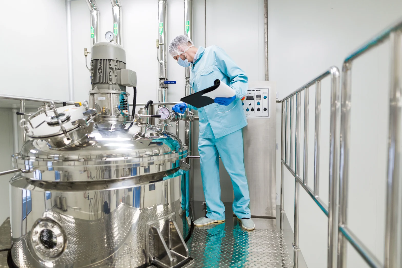 American manufacturing technician inspecting a pressure vessel weld