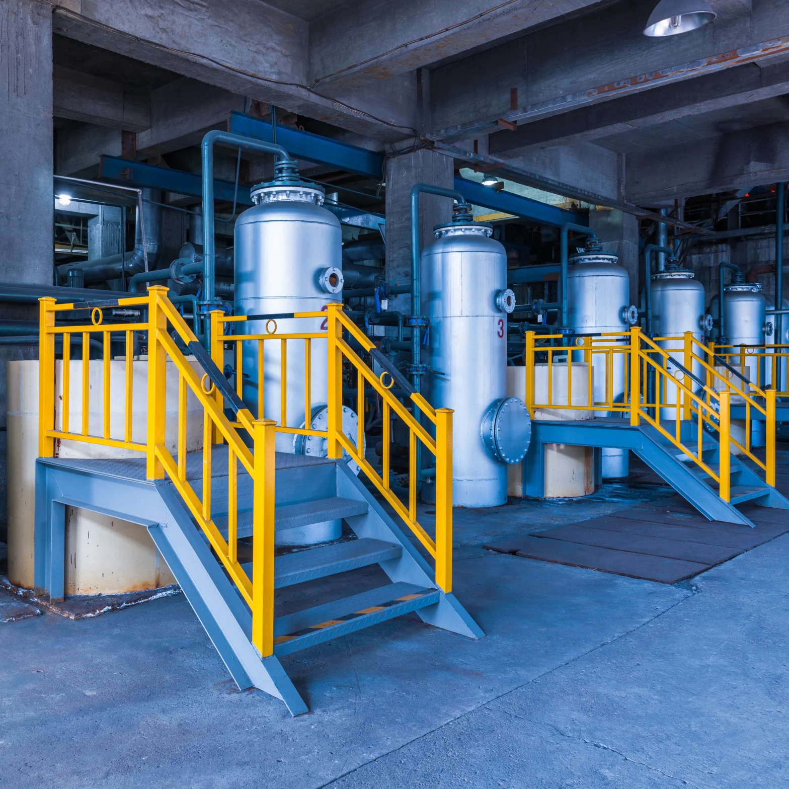 Industrial pressure vessels in manufacturing facility showing safety compliance and code standards