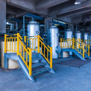 Industrial pressure vessels in manufacturing facility showing safety compliance and code standards