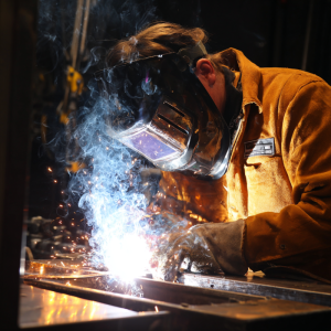 Welder showing how to do 4g welding position overhead technique