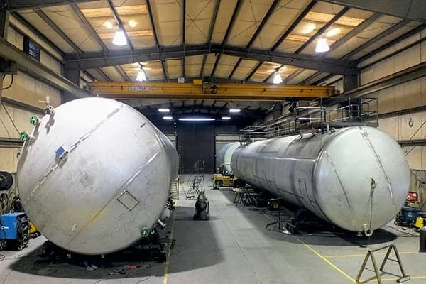a couple of large tanks sitting inside of a building