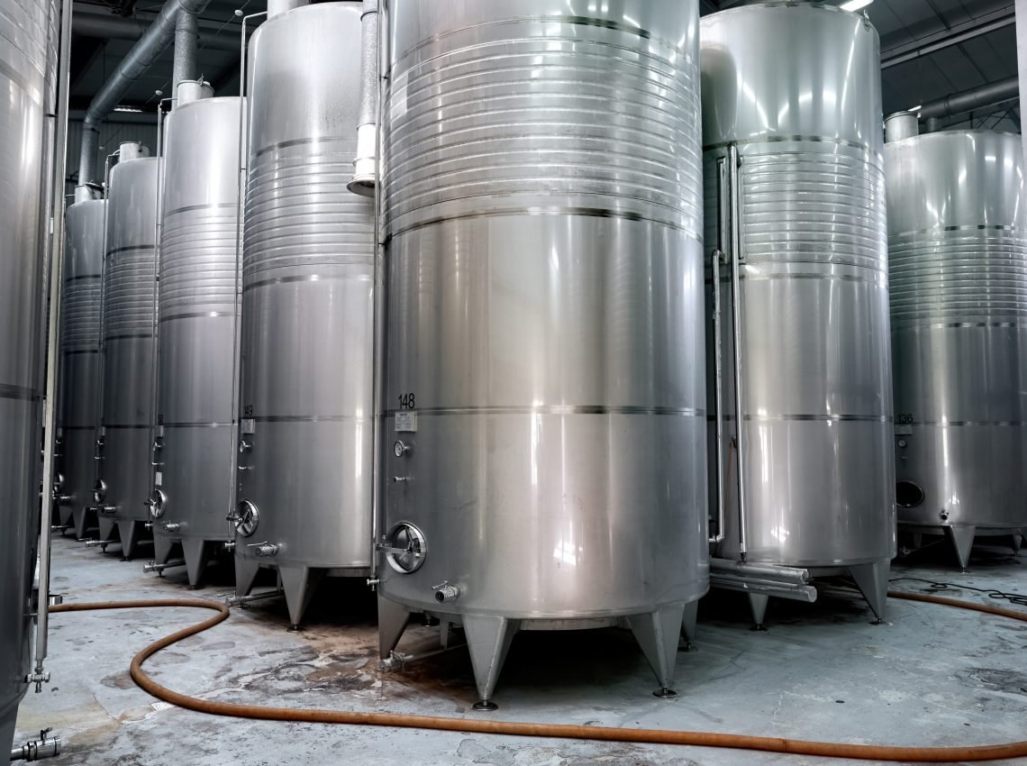 Metallic wine storage tanks at a winery