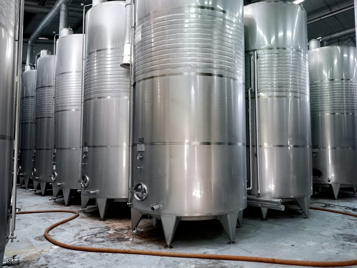 Metallic wine storage tanks at a winery